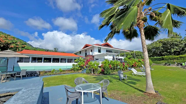 a view of a house with a yard patio and sitting area