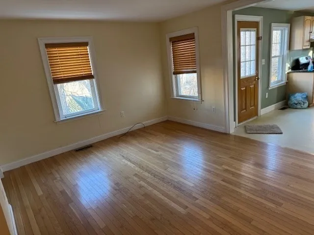 an empty room with a empty space and a window