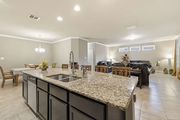 a kitchen with counter top space sink stove and oven