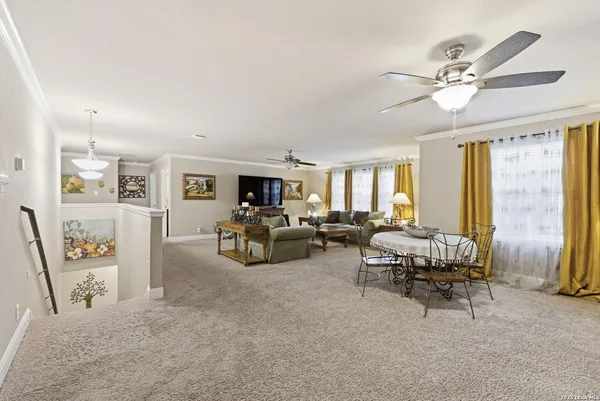 a living room with furniture and white walls