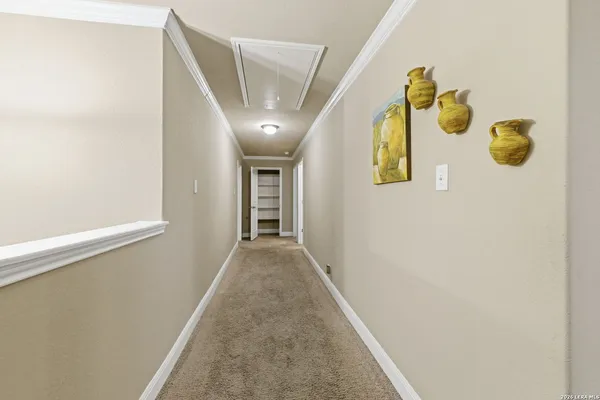 a view of hallway with wooden floor