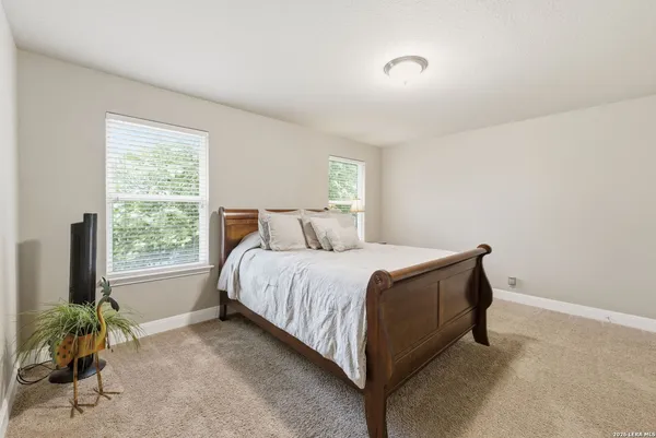 a bedroom with a bed a desk and chair