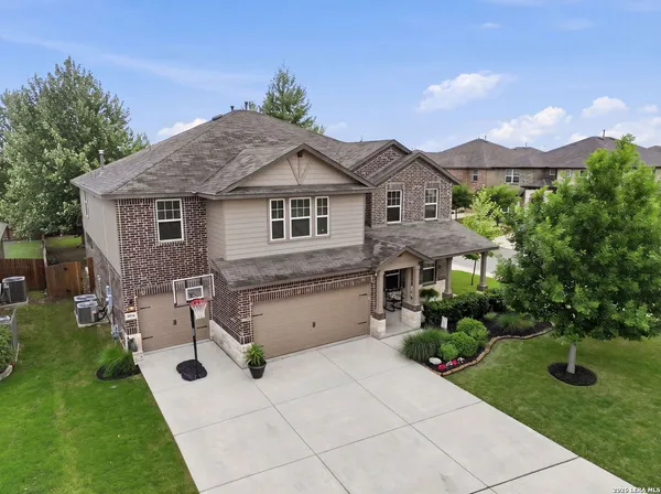 an aerial view of a house having yard