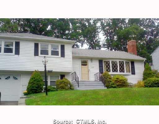 237 Dale Road Wethersfield, CT 06109 - Photo 1 of 1 a black and white house with a yard
