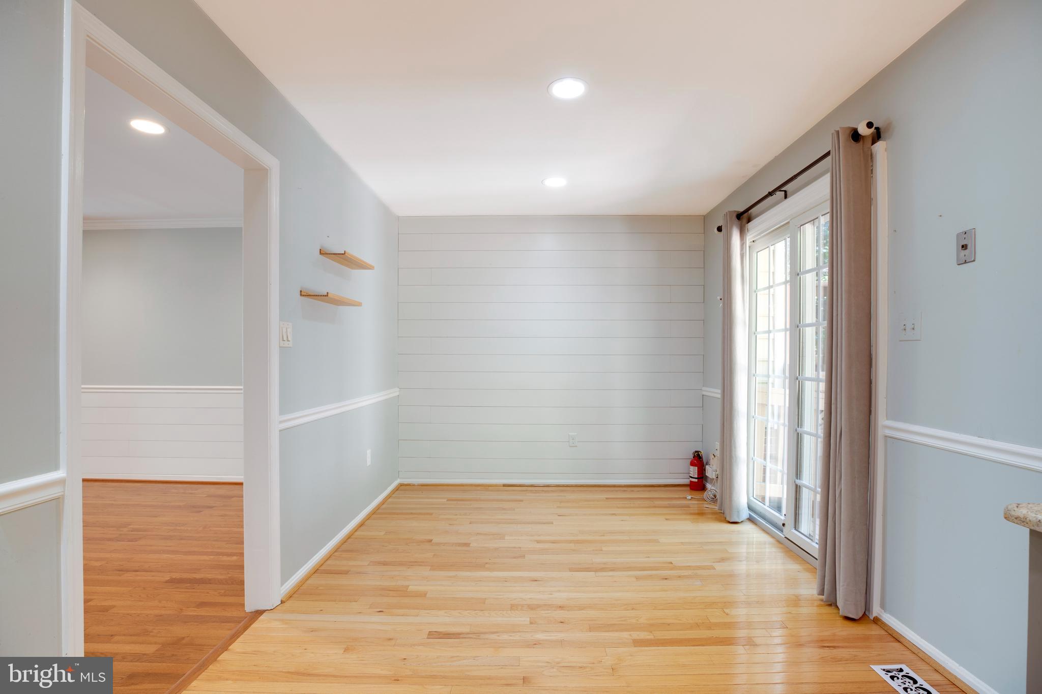 160 Washington Street Occoquan, VA 22125 - Photo 12 of 30 a view of empty room with wooden floor and fan