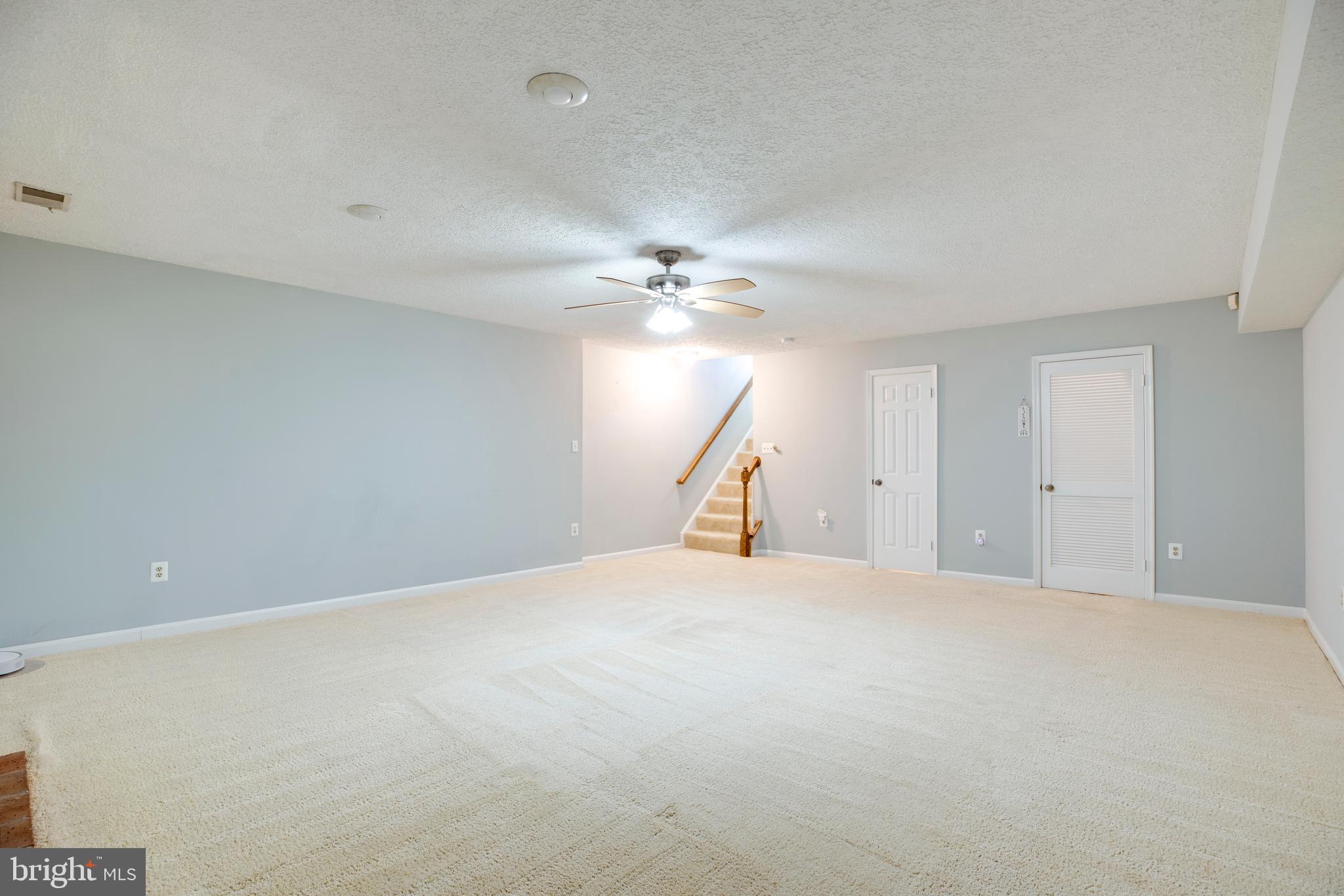 160 Washington Street Occoquan, VA 22125 - Photo 26 of 30 a view of a livingroom with a ceiling fan and a chandelier fan