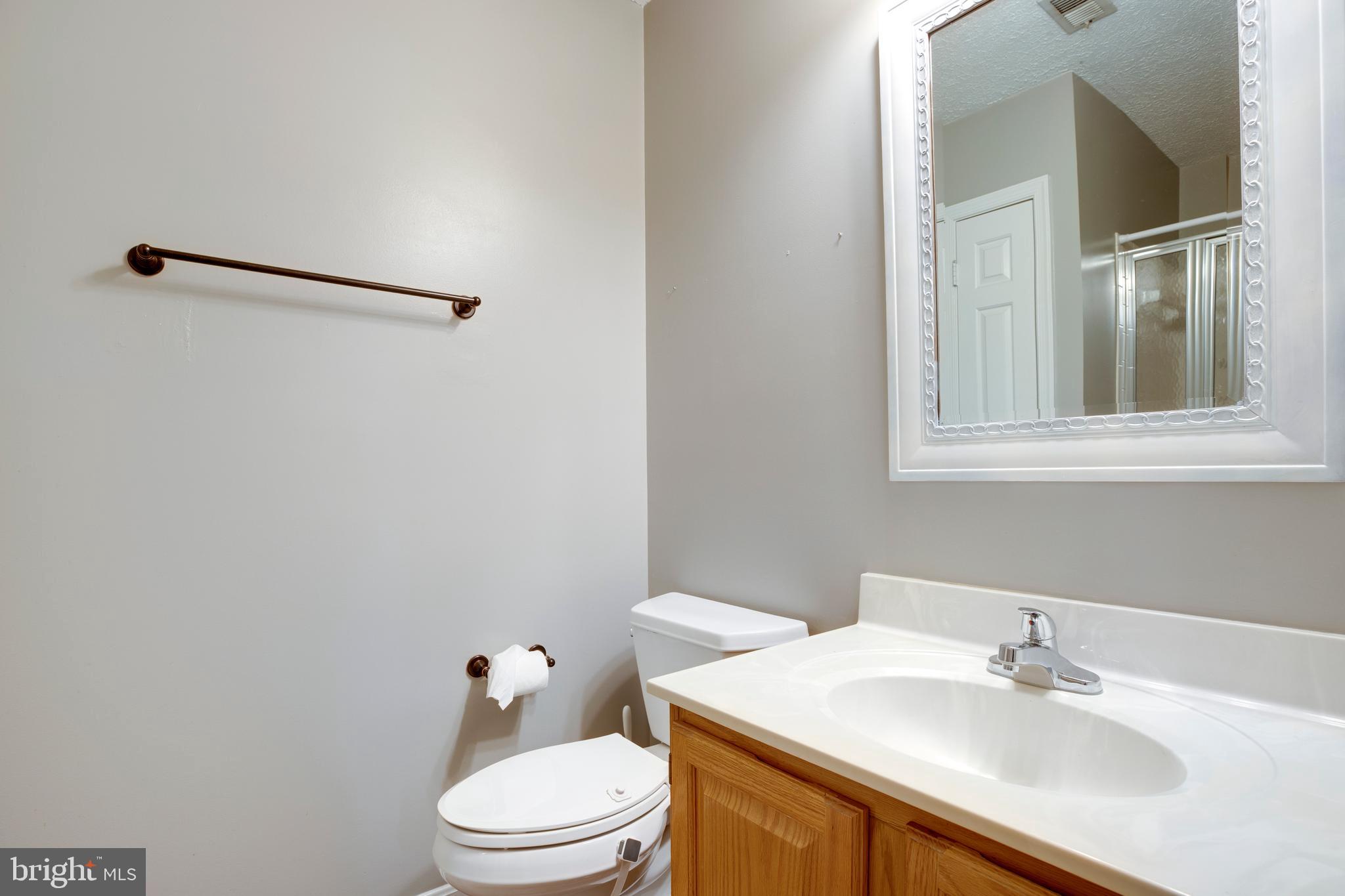 160 Washington Street Occoquan, VA 22125 - Photo 27 of 30 a bathroom with a sink vanity mirror and toilet