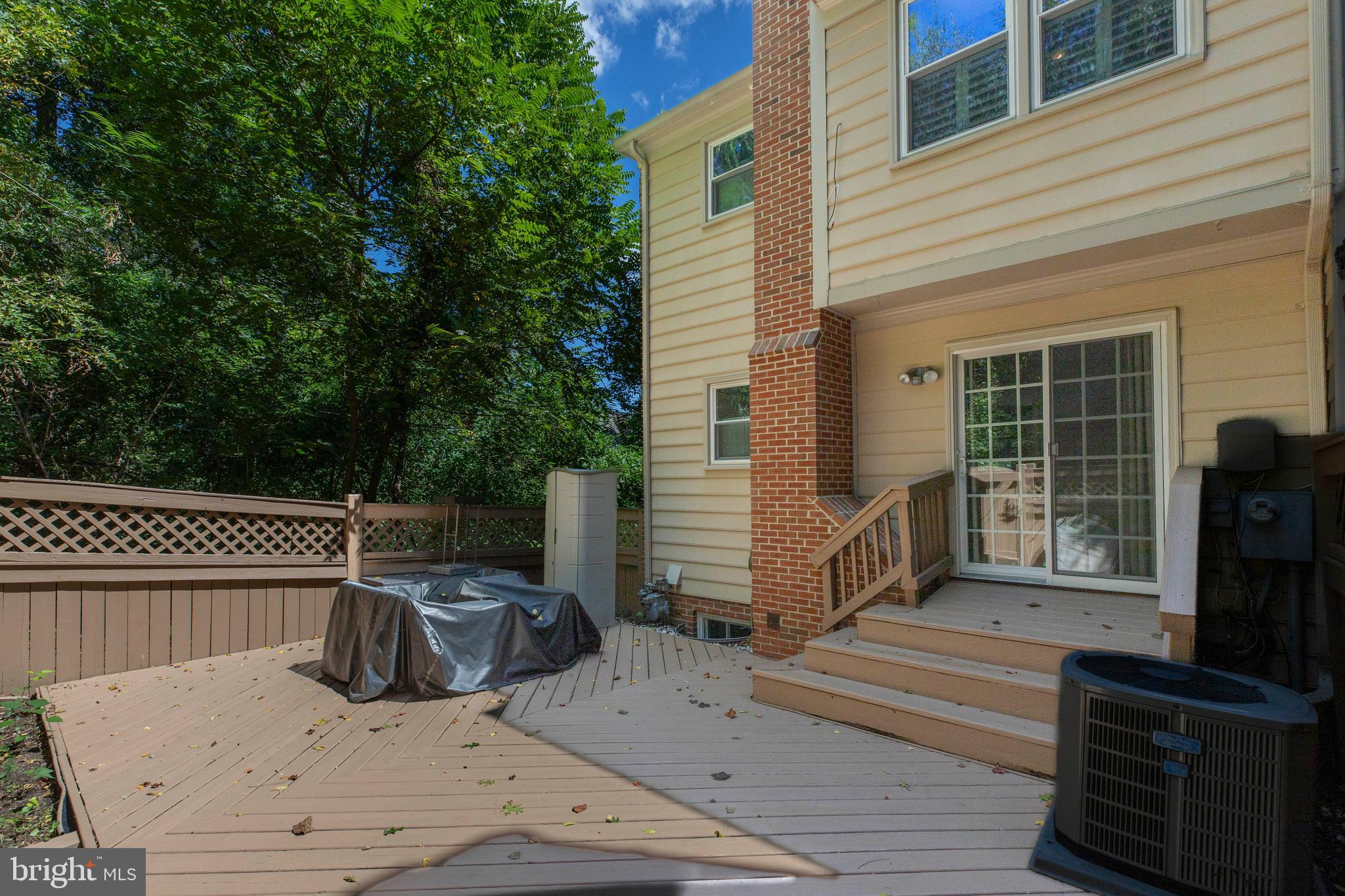 160 Washington Street Occoquan, VA 22125 - Photo 30 of 30 a view of a roof deck with table and chairs a barbeque with wooden floor and fence