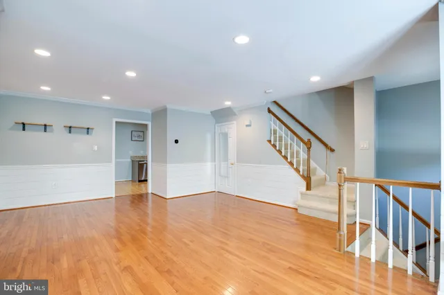 a view of an entryway with wooden floor