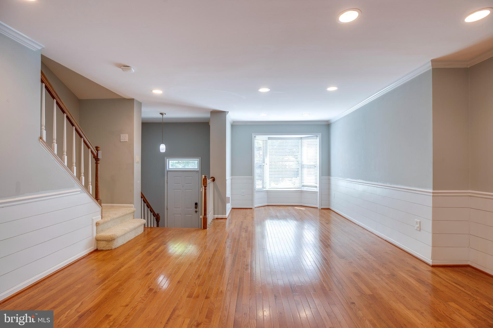 160 Washington Street Occoquan, VA 22125 - Photo 7 of 30 a view of an empty room with wooden floor and a window