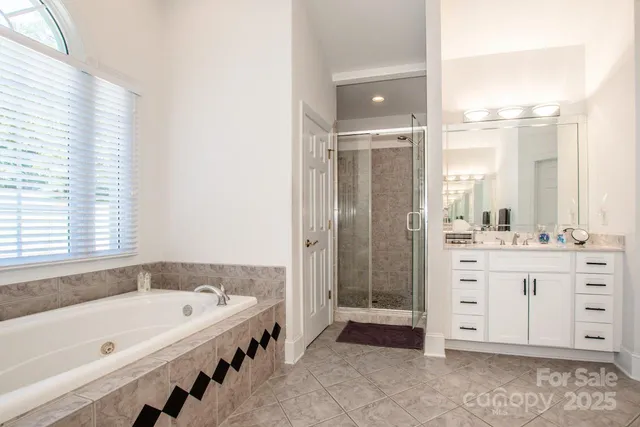 a bathroom with a bathtub and a sink