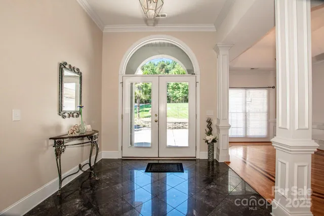 a view of an entryway with wooden floor