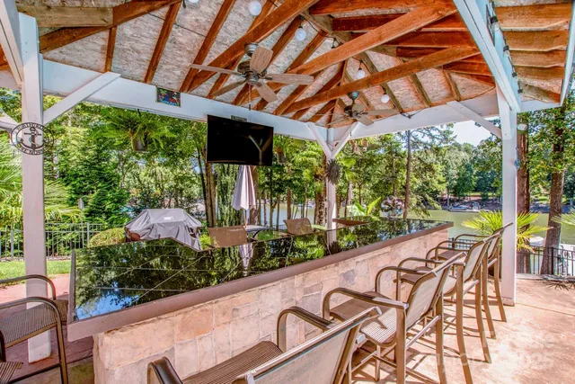 a view of swimming pool with a patio