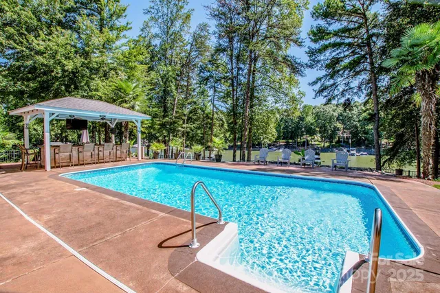a view of a swimming pool with a patio