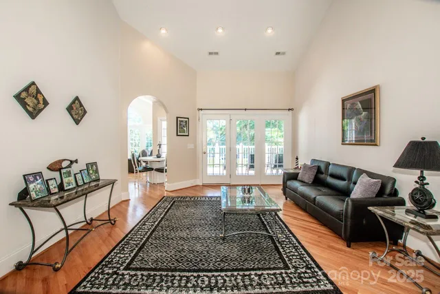 a living room with furniture and a rug