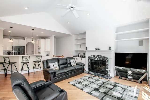 a living room with furniture and a fireplace