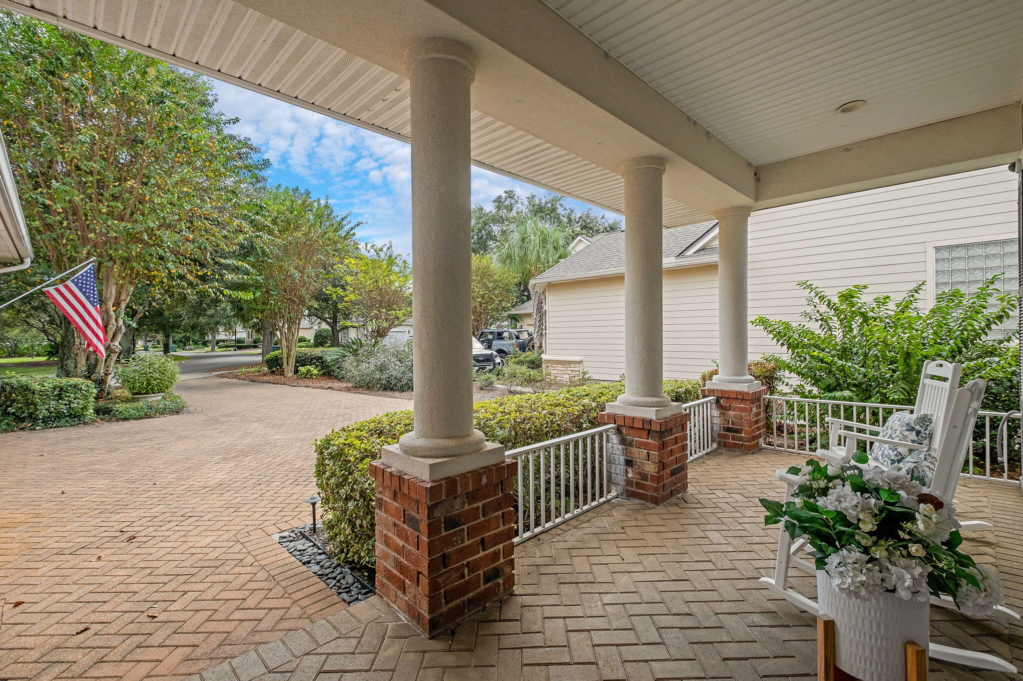 384 Terrapin Destin, FL 32541 - Photo 8 of 21 a view of a porch with chairs and potted plants