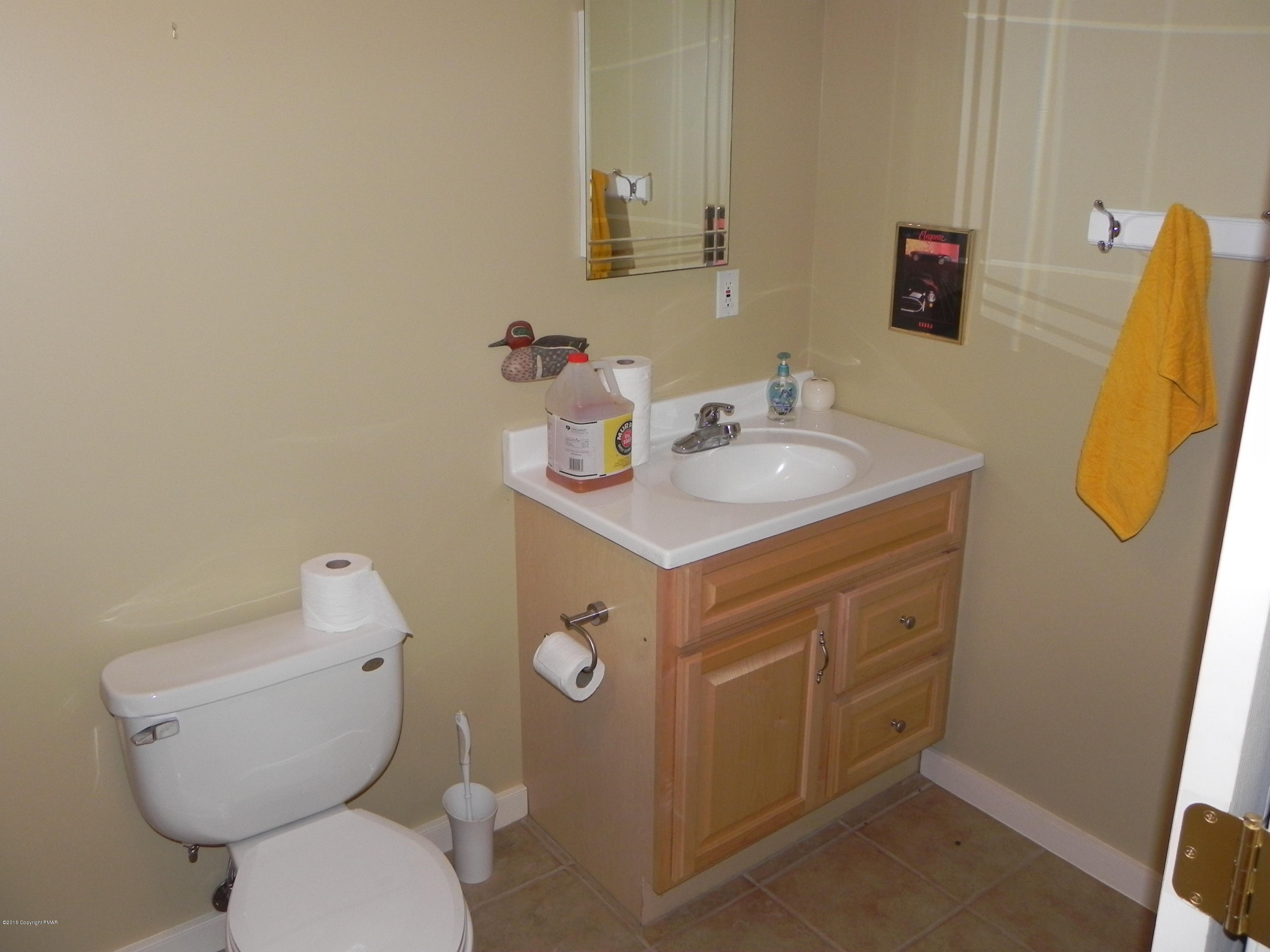 2342 Point Phillips Road Kunkletown, PA 18058 - Photo 16 of 28 a bathroom with a toilet sink and mirror