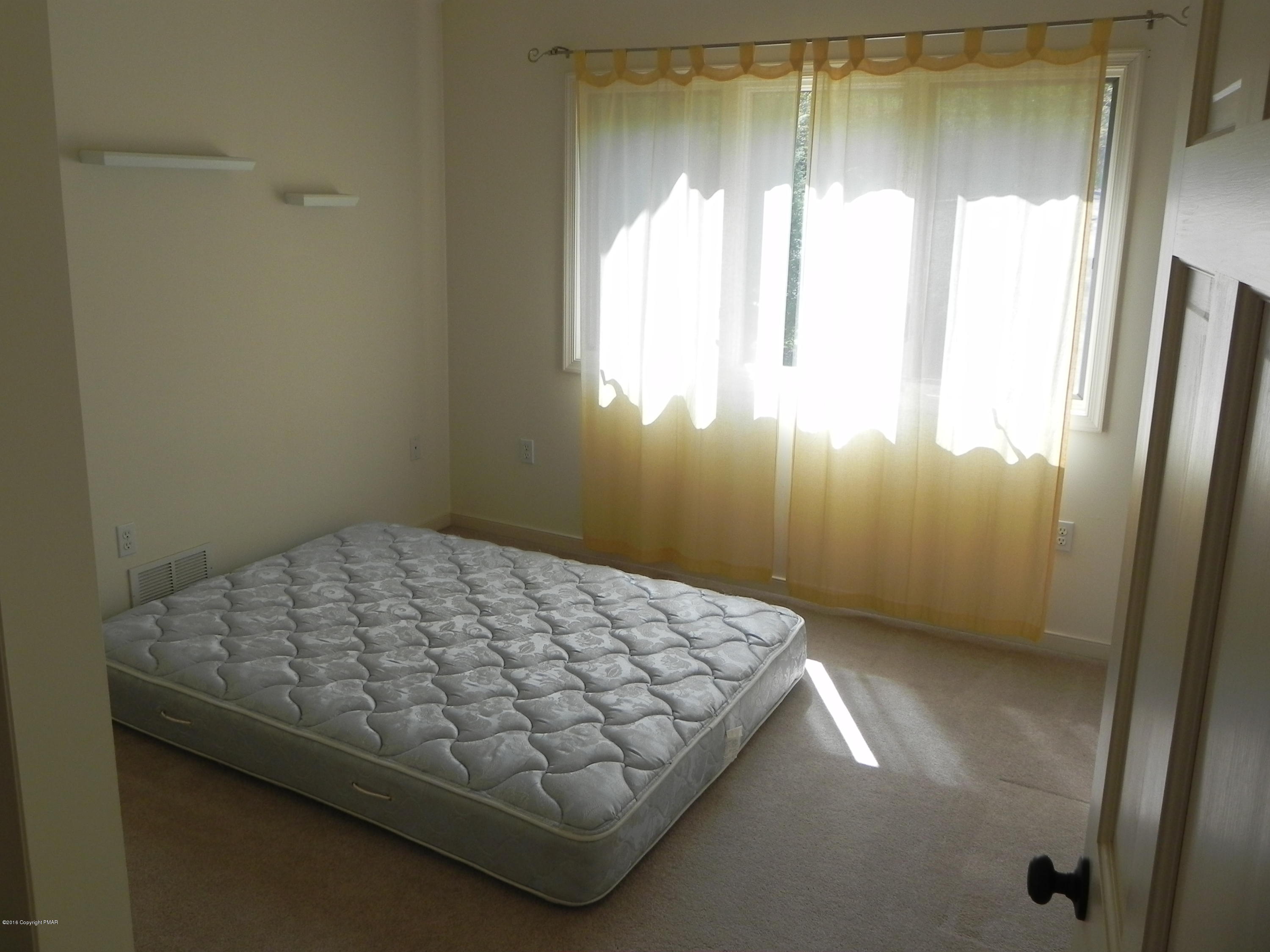 2342 Point Phillips Road Kunkletown, PA 18058 - Photo 18 of 28 a bedroom with a bed and a window