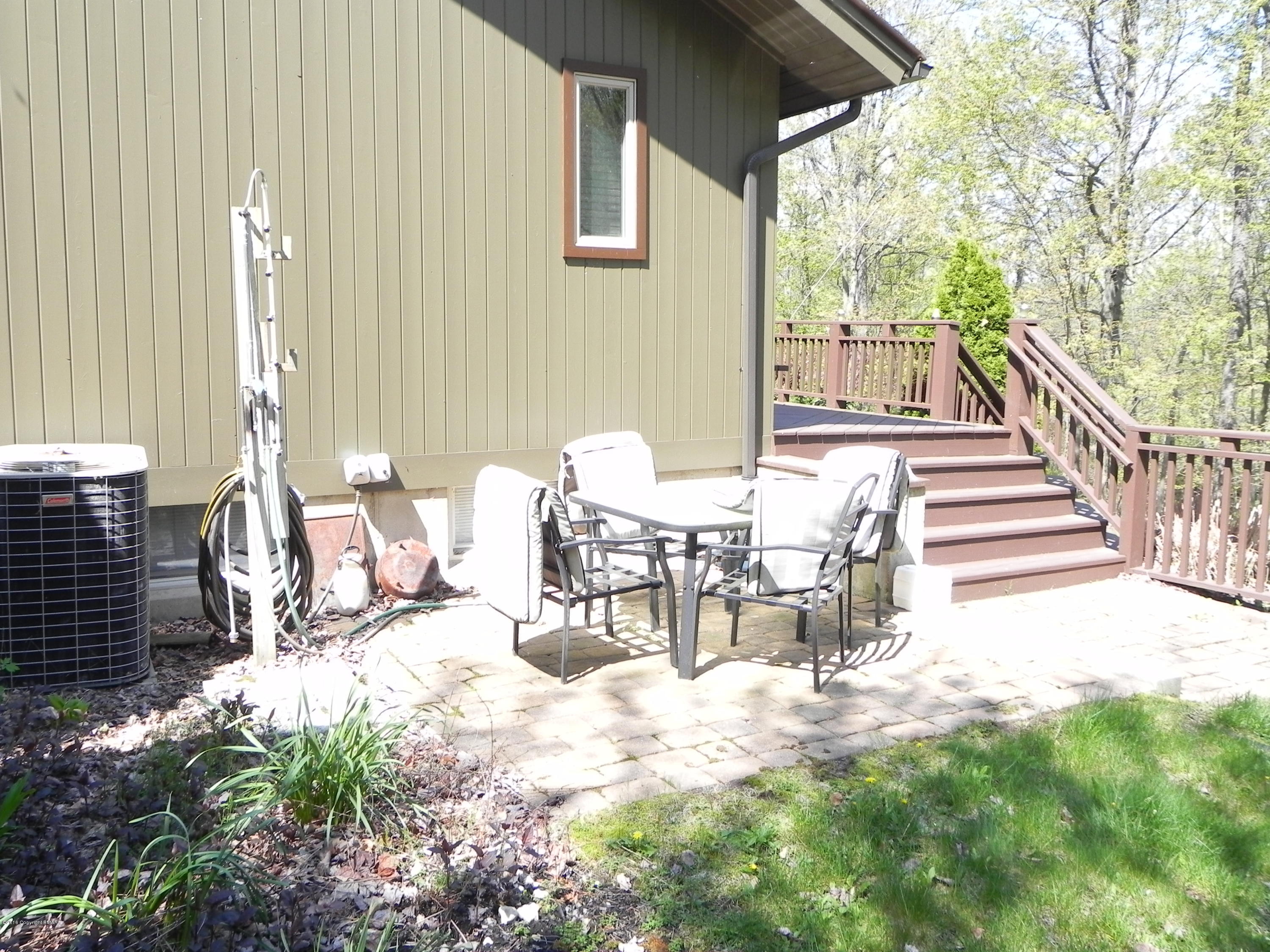 2342 Point Phillips Road Kunkletown, PA 18058 - Photo 24 of 28 a view of a patio with table and chairs and wooden fence