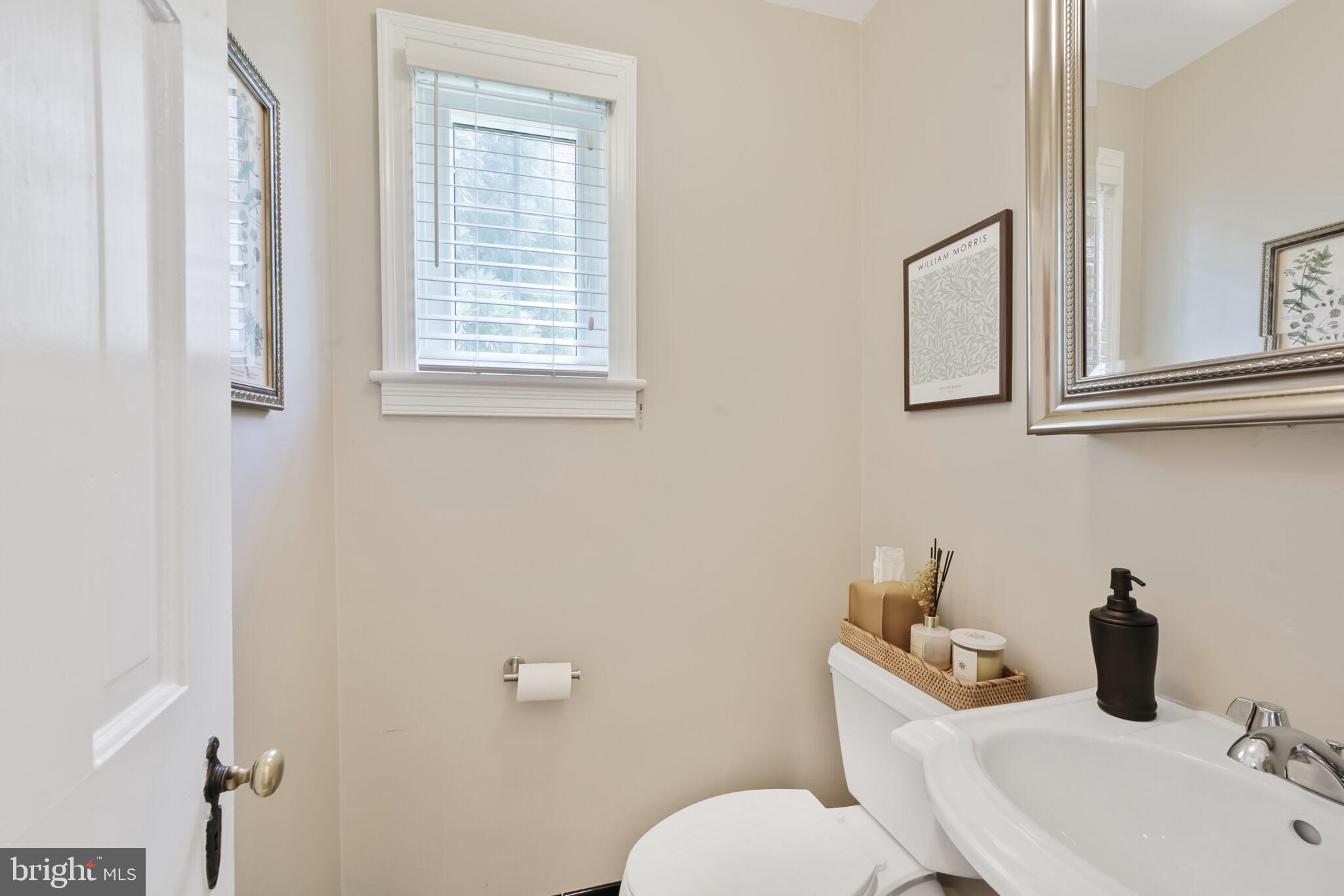 1512 Live Oak Drive Silver Spring, MD 20910 - Photo 18 of 34 a bathroom with a toilet sink and mirror