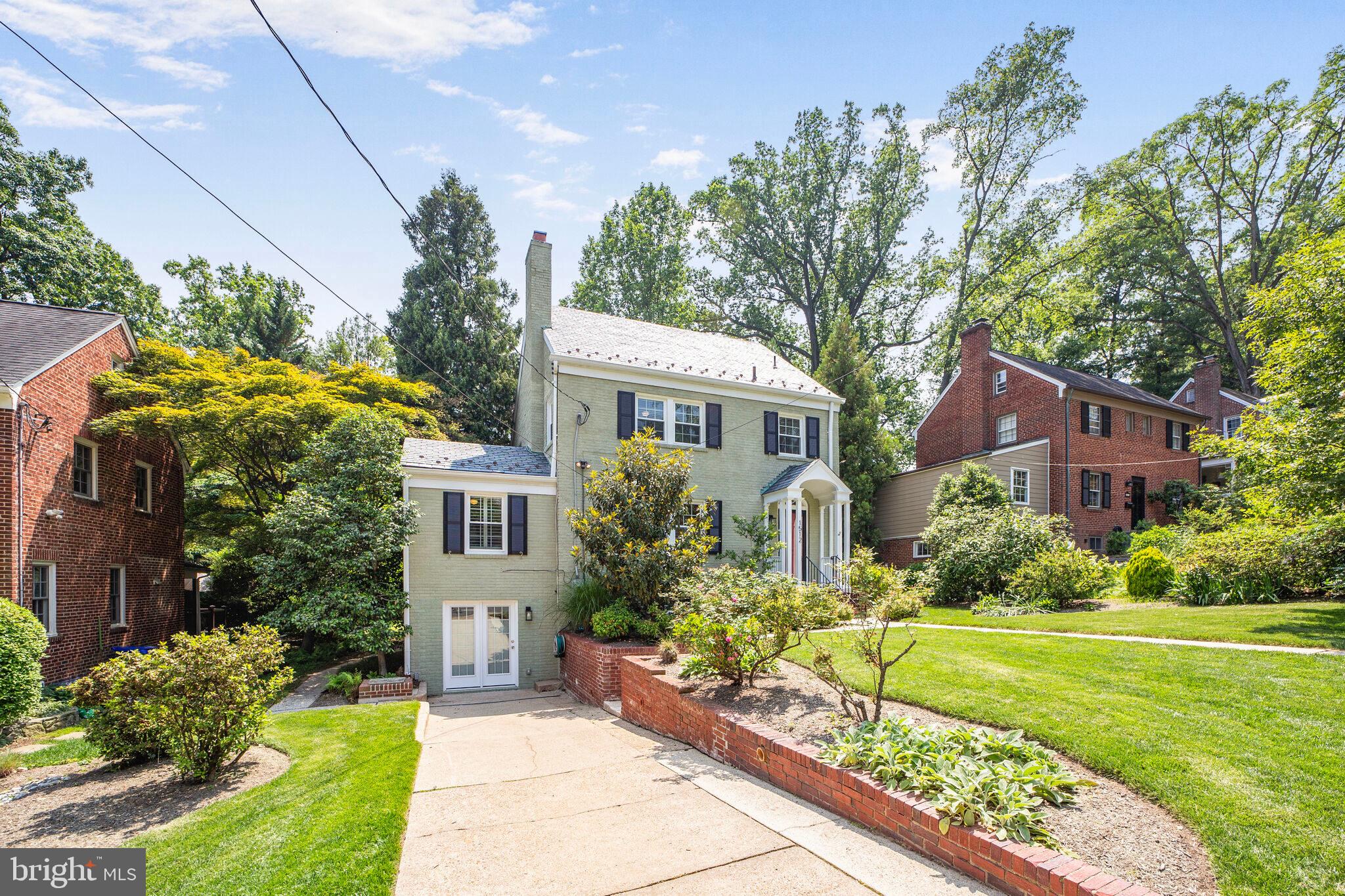 1512 Live Oak Drive Silver Spring, MD 20910 - Photo 2 of 34 a front view of a house with garden