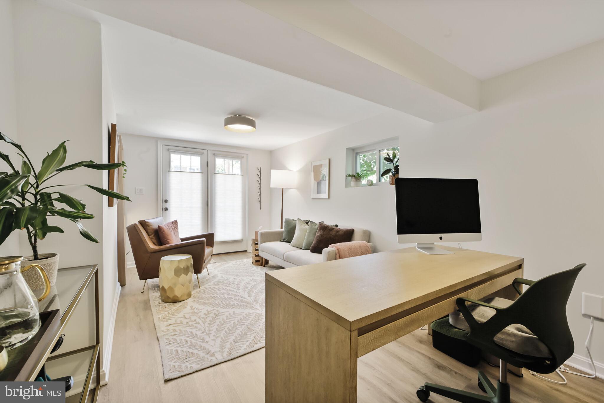 1512 Live Oak Drive Silver Spring, MD 20910 - Photo 25 of 34 a living room with furniture and a laptop