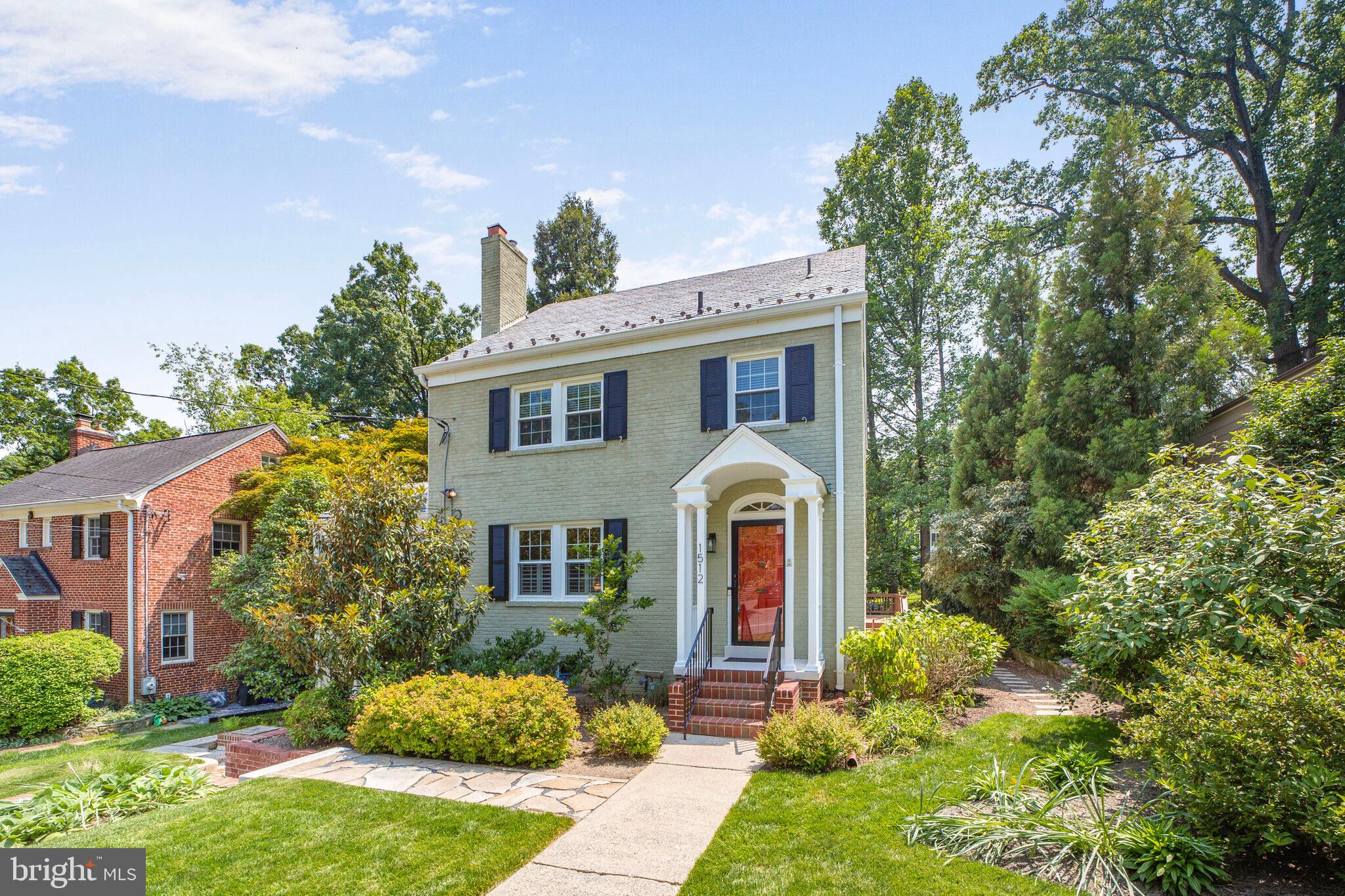 1512 Live Oak Drive Silver Spring, MD 20910 - Photo 3 of 34 a front view of a house with garden