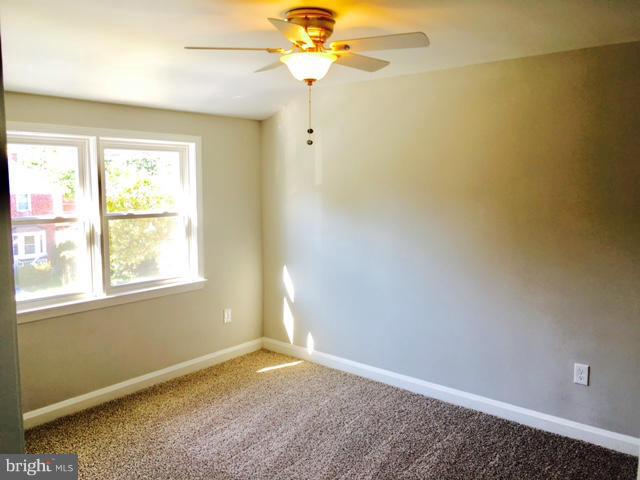 6023 Falkirk Road Baltimore, MD 21239 - Photo 11 of 20 a view of an empty room with a window