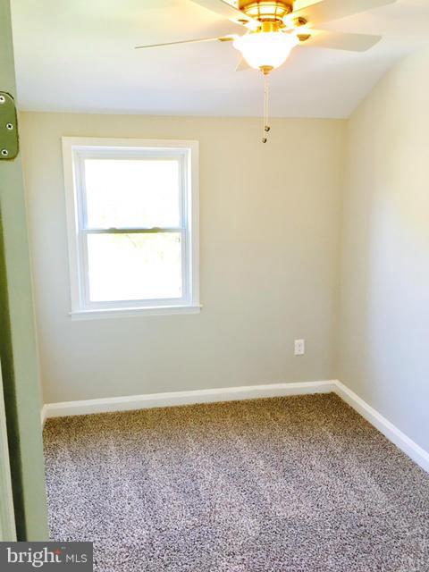 6023 Falkirk Road Baltimore, MD 21239 - Photo 14 of 20 an empty room with a window