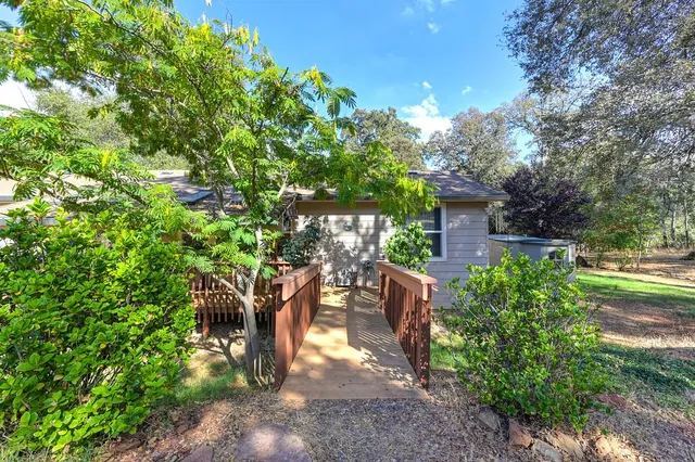 a backyard of a house with lots of green space