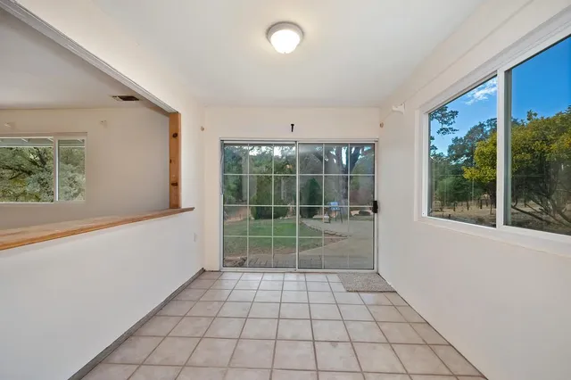 a view of empty room with windows