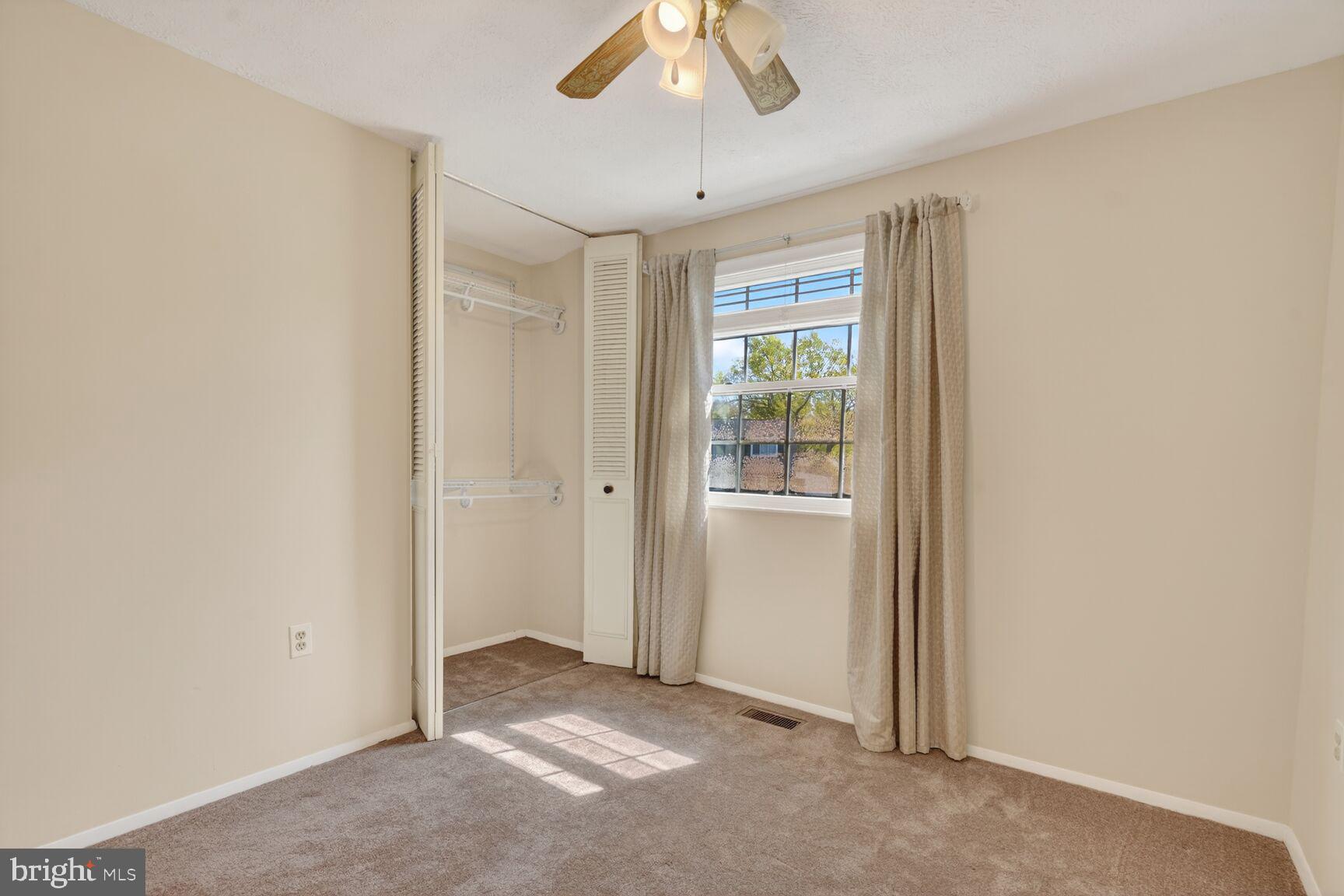 2806 Logway Road Vienna, VA 22181 - Photo 17 of 33 a view of a livingroom with a ceiling fan and window