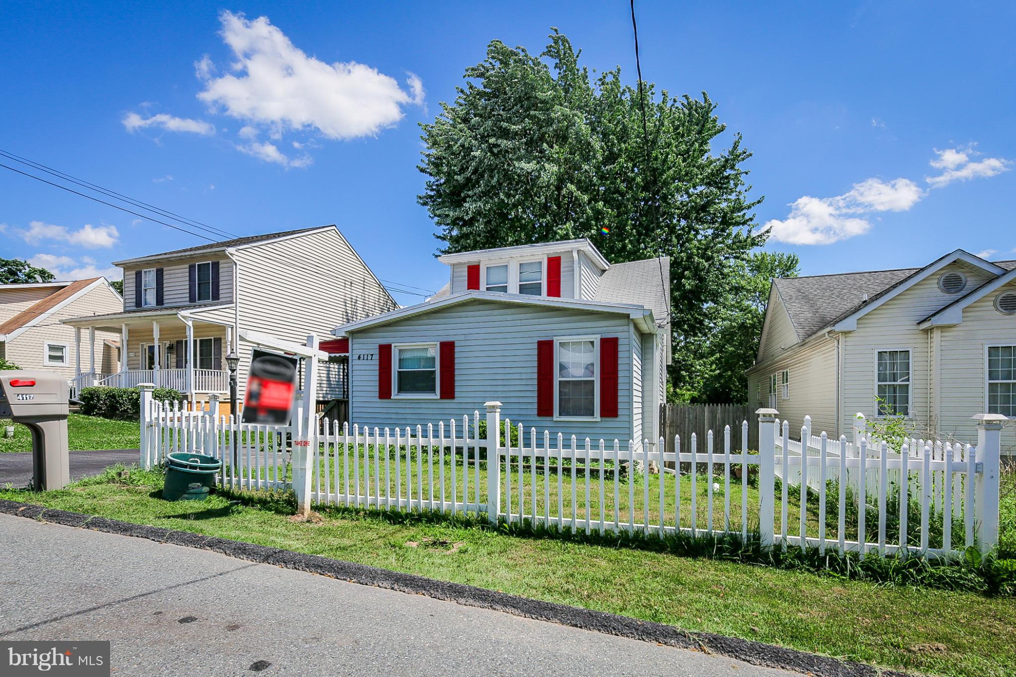4117 Old Washington Road Baltimore, MD 21227 - Photo 27 of 27 a front view of a house with a small yard