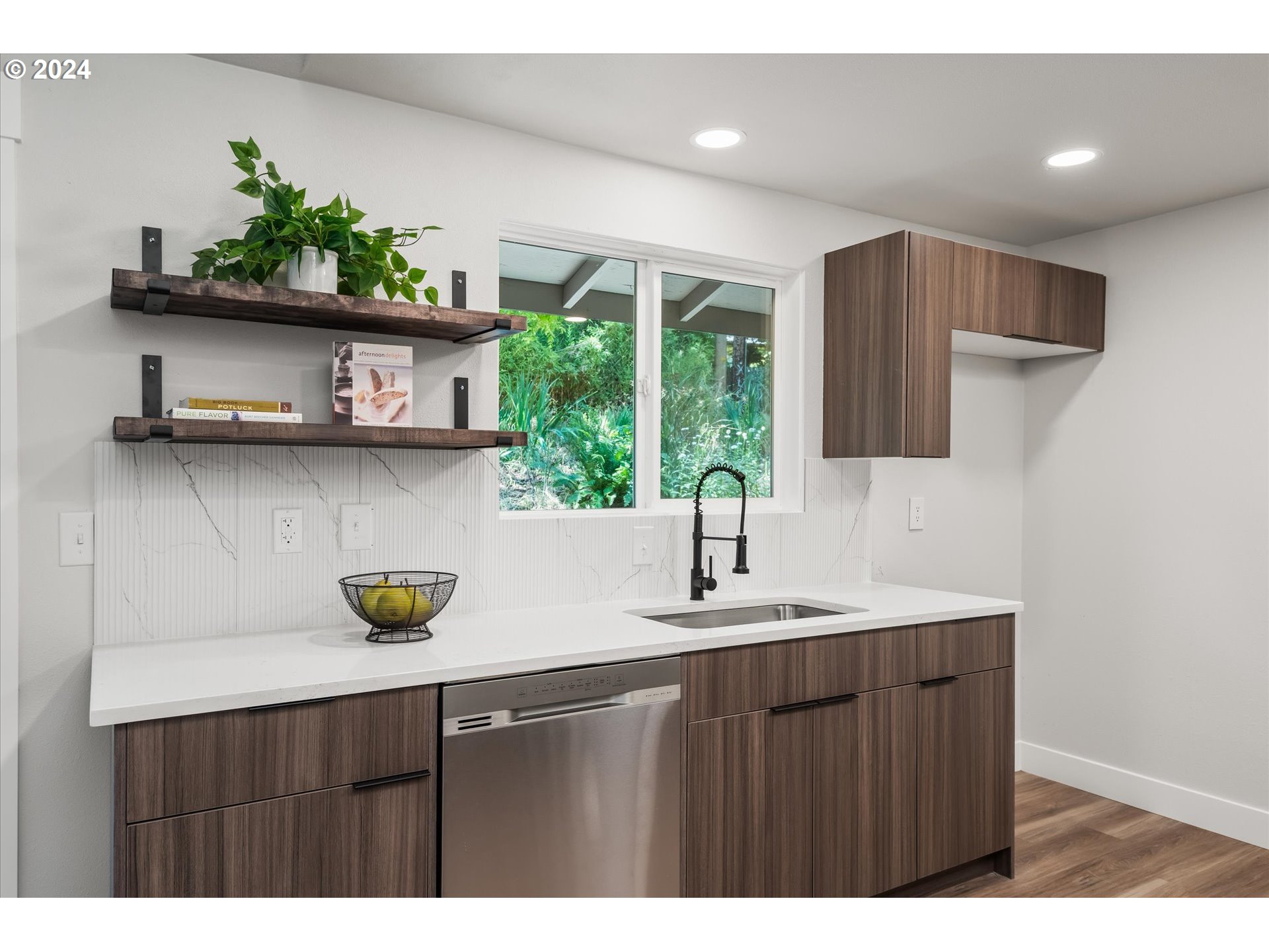 70 Coachman Drive Eugene, OR 97405 - Photo 12 of 43 a kitchen with a sink a counter space and cabinets