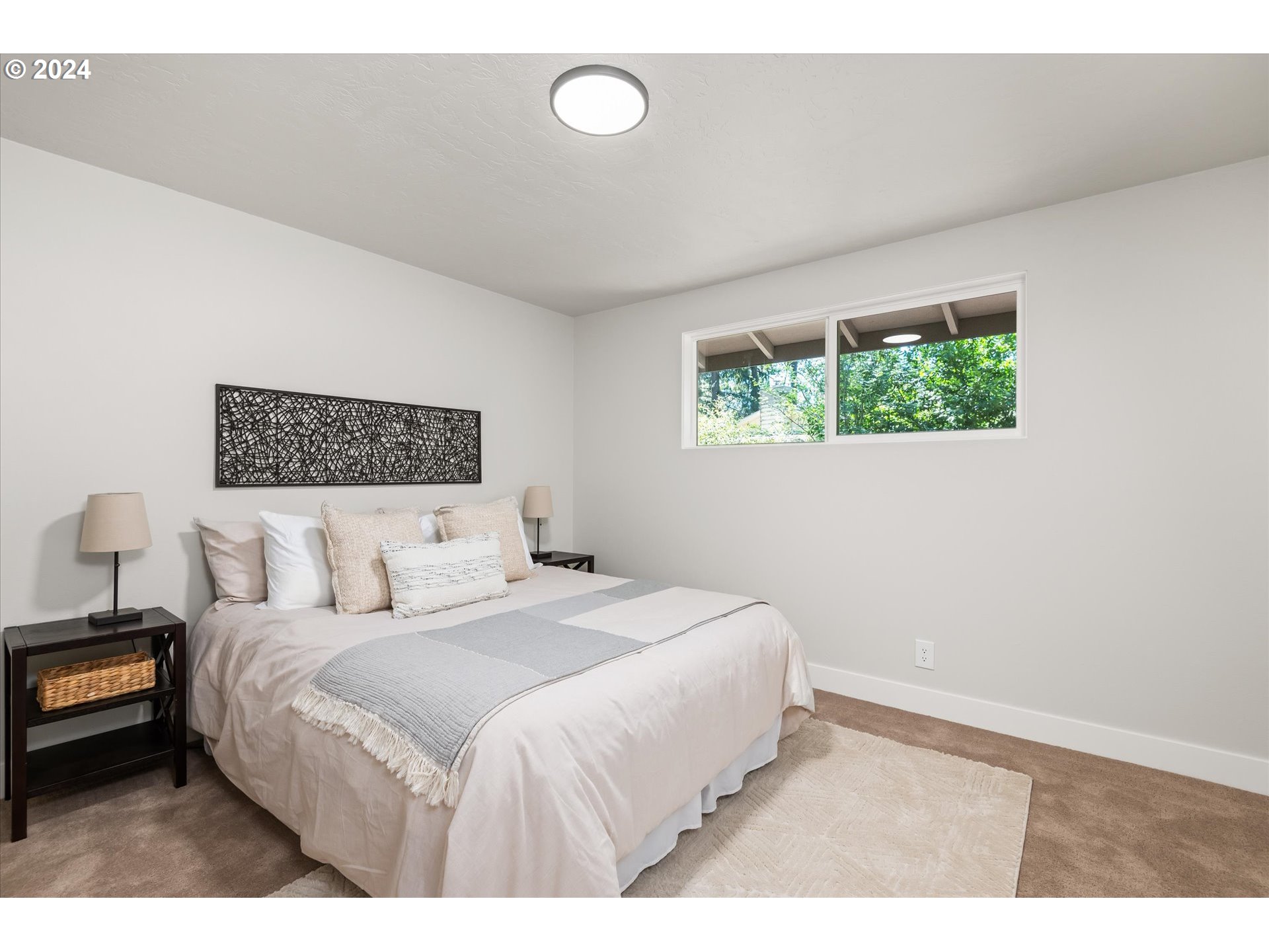 70 Coachman Drive Eugene, OR 97405 - Photo 14 of 43 a bedroom with a bed and a painting on the wall