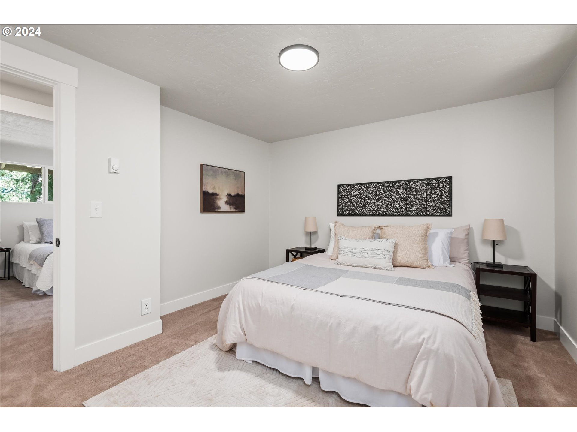 70 Coachman Drive Eugene, OR 97405 - Photo 15 of 43 a bedroom with a bed and a painting