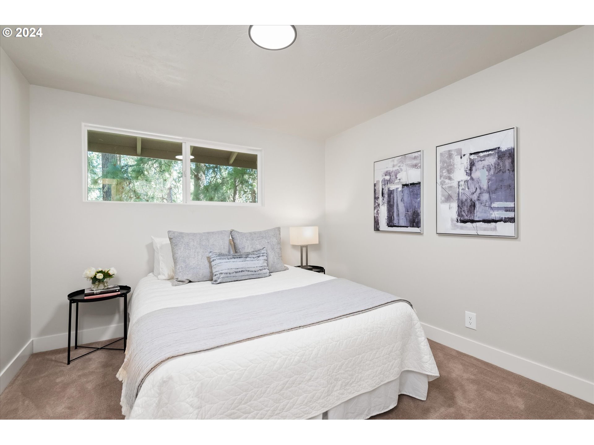 70 Coachman Drive Eugene, OR 97405 - Photo 17 of 43 a bedroom with a bed and a chair