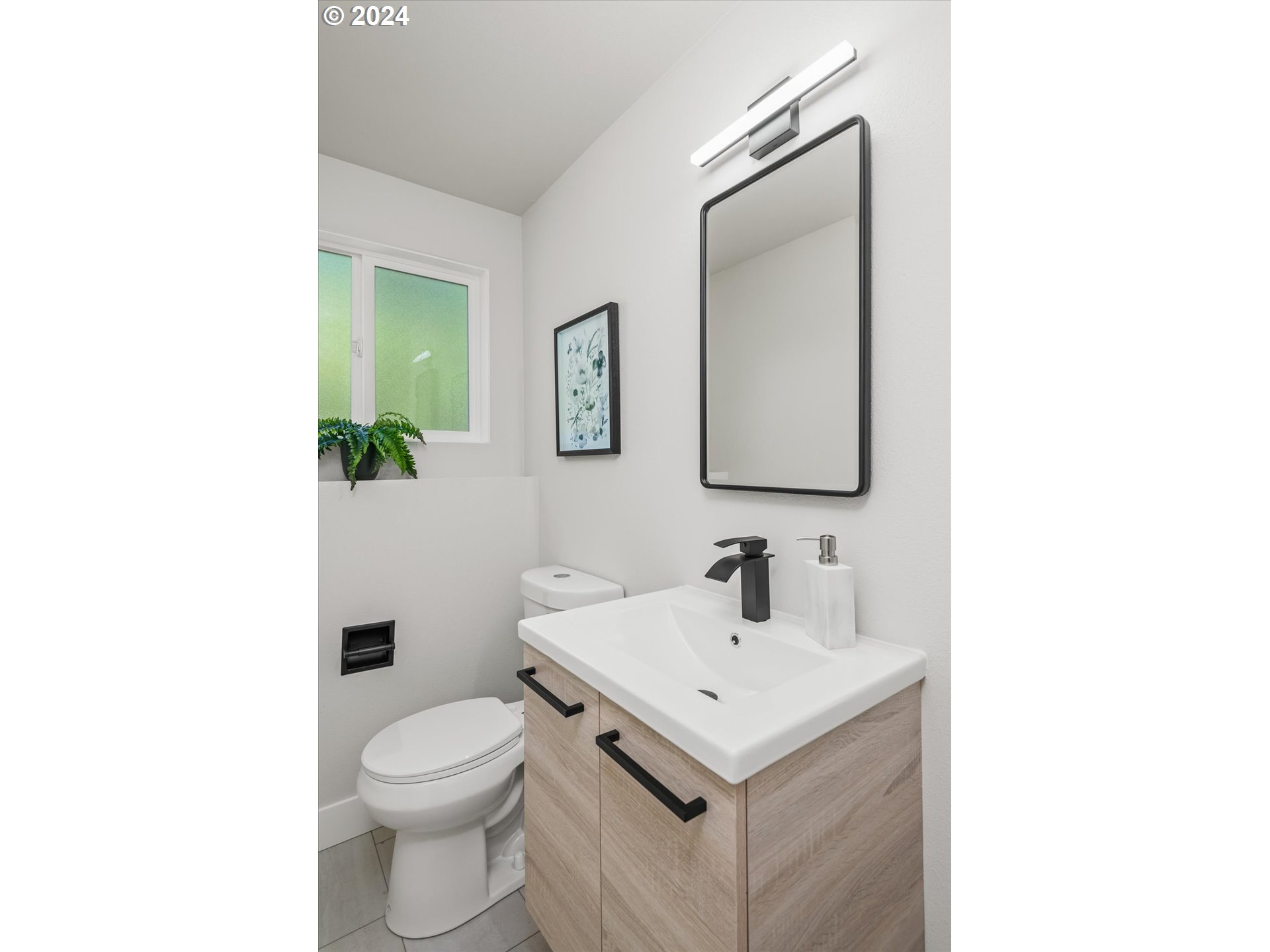 70 Coachman Drive Eugene, OR 97405 - Photo 26 of 43 a bathroom with a toilet sink and mirror