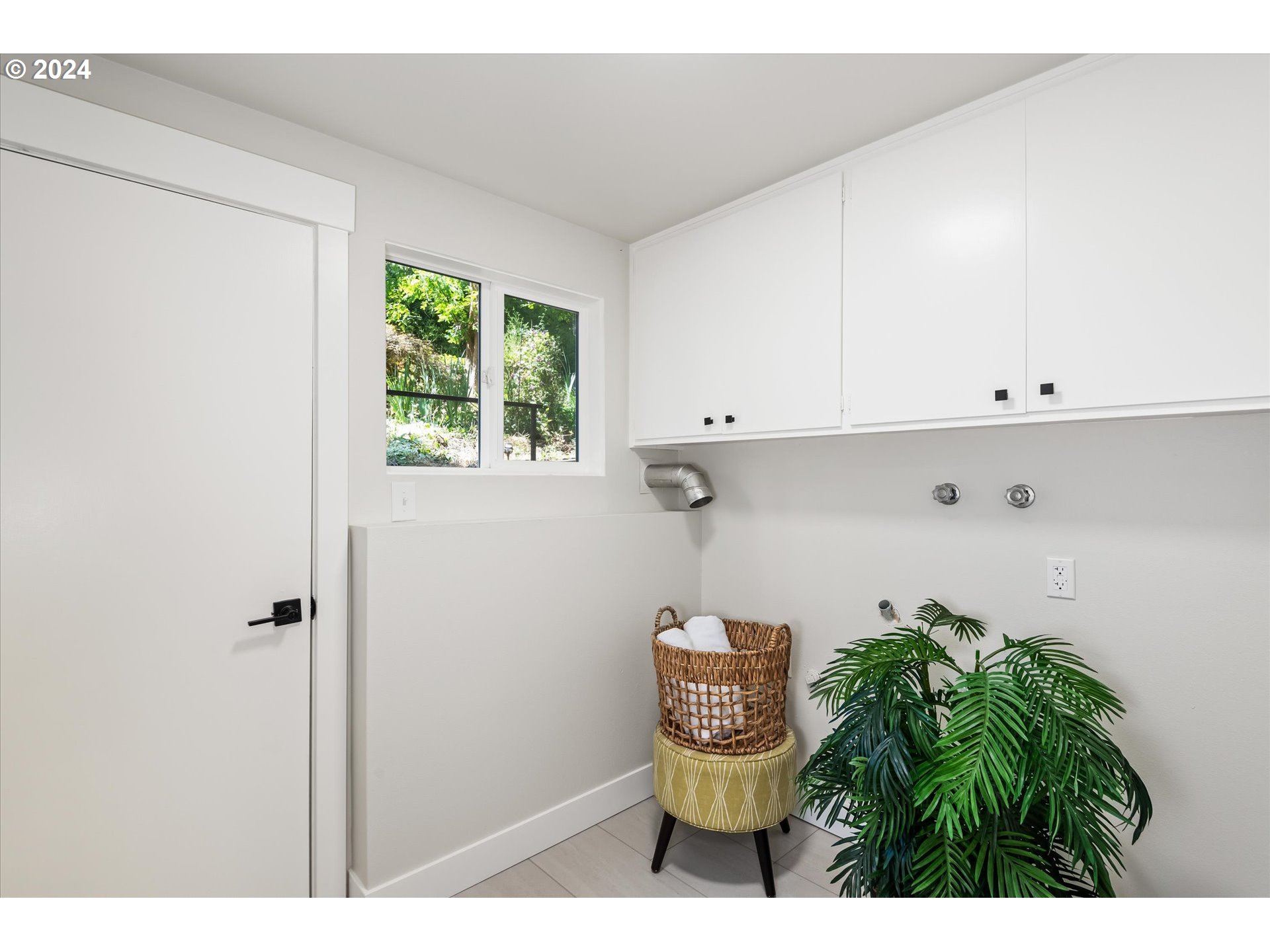 70 Coachman Drive Eugene, OR 97405 - Photo 27 of 43 a bathroom with a toilet and a window