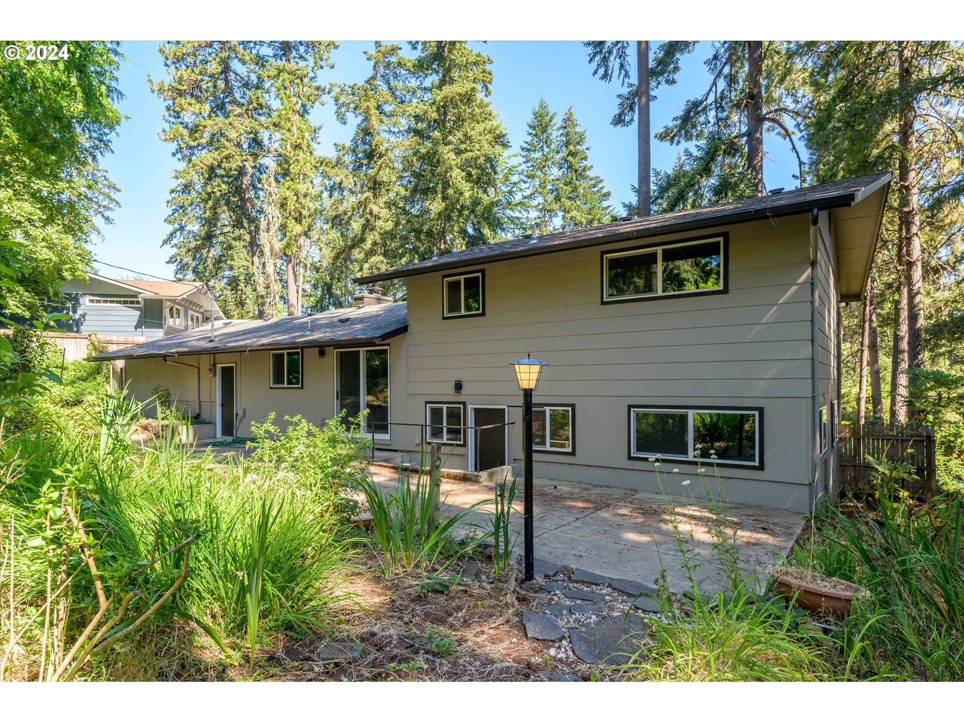 70 Coachman Drive Eugene, OR 97405 - Photo 29 of 43 a view of a house with a yard
