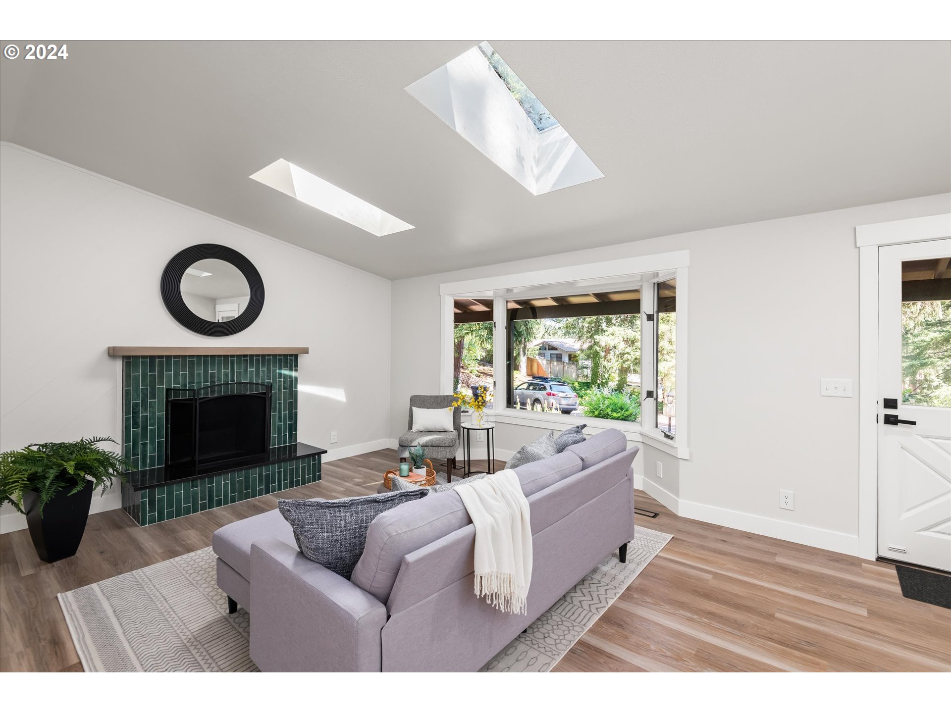 70 Coachman Drive Eugene, OR 97405 - Photo 5 of 43 a living room with furniture and a fireplace
