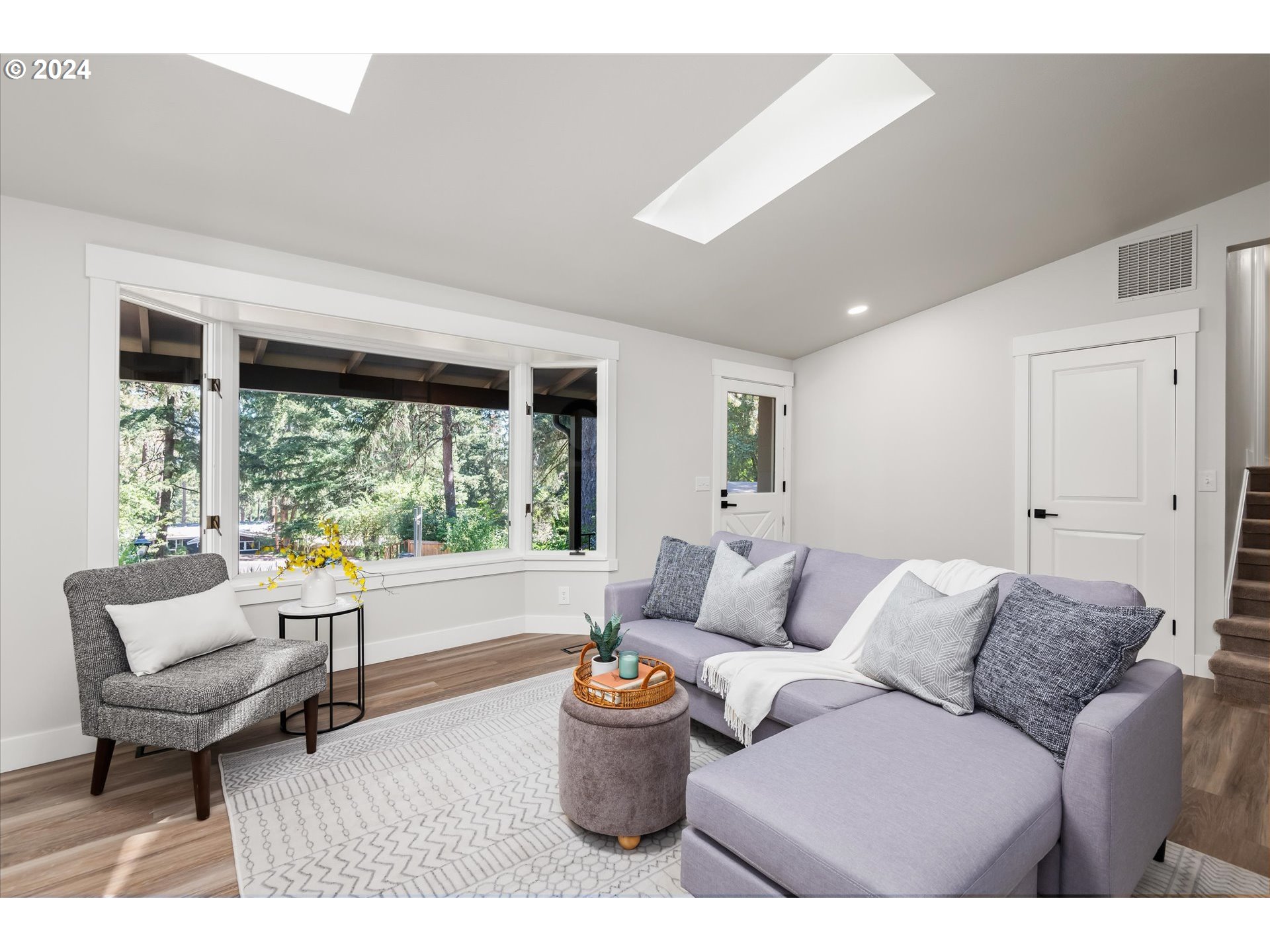 70 Coachman Drive Eugene, OR 97405 - Photo 6 of 43 a living room with furniture and a large window