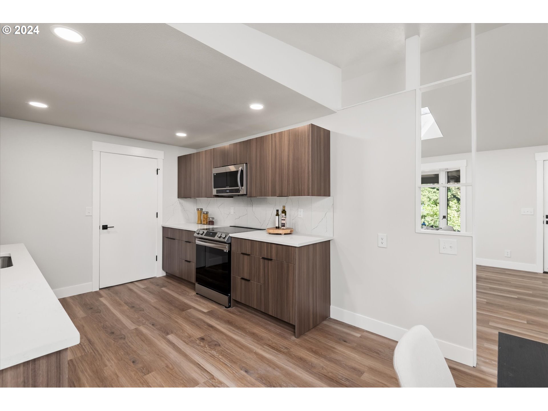 70 Coachman Drive Eugene, OR 97405 - Photo 10 of 43 a kitchen with stainless steel appliances granite countertop a stove a sink and a refrigerator