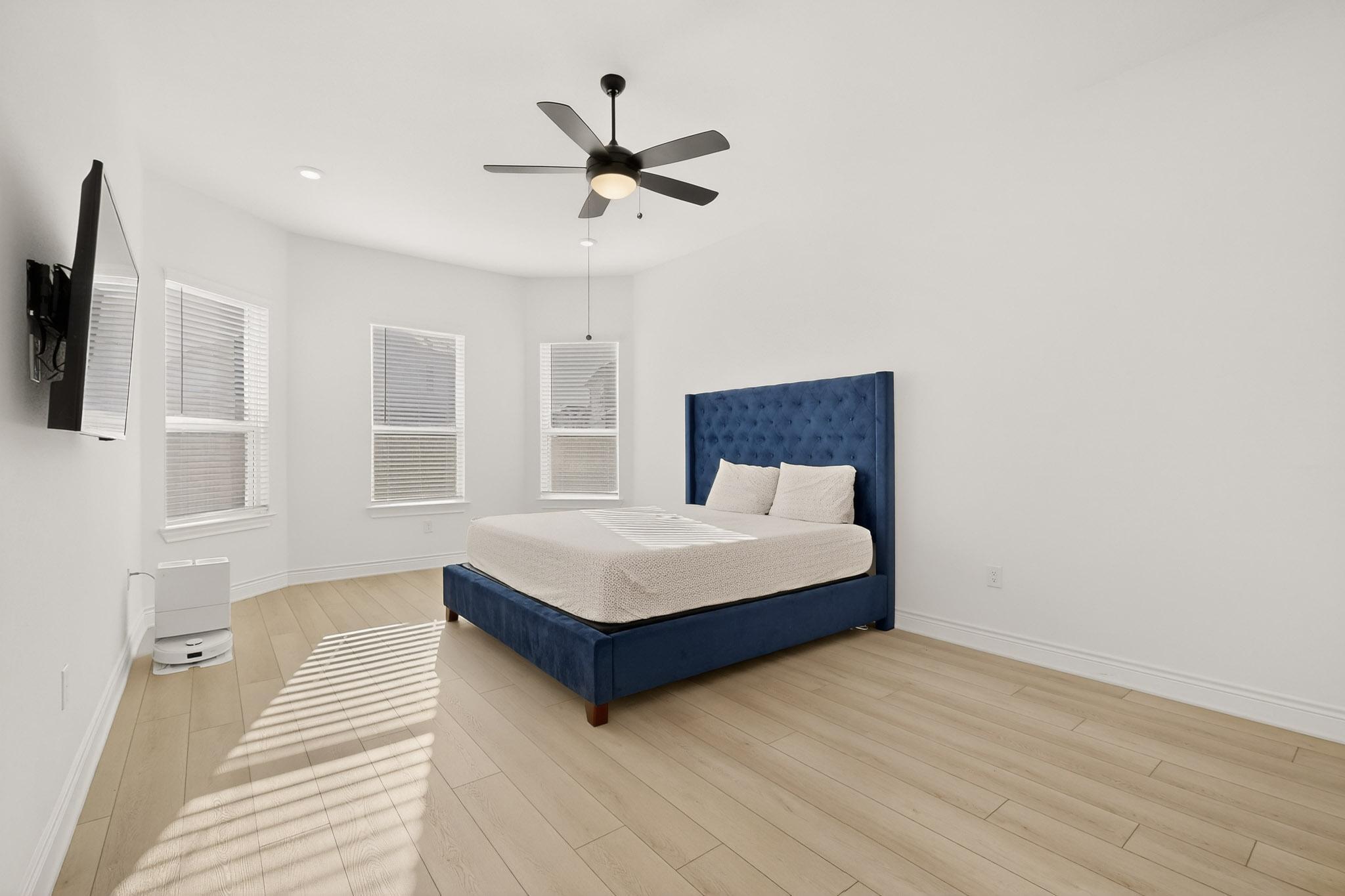 2121 Lolo Lane Leander, TX 78641 - Photo 10 of 26 Bedroom with a ceiling fan and light wood finished floors