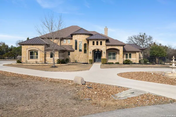 an aerial view of a house with yard