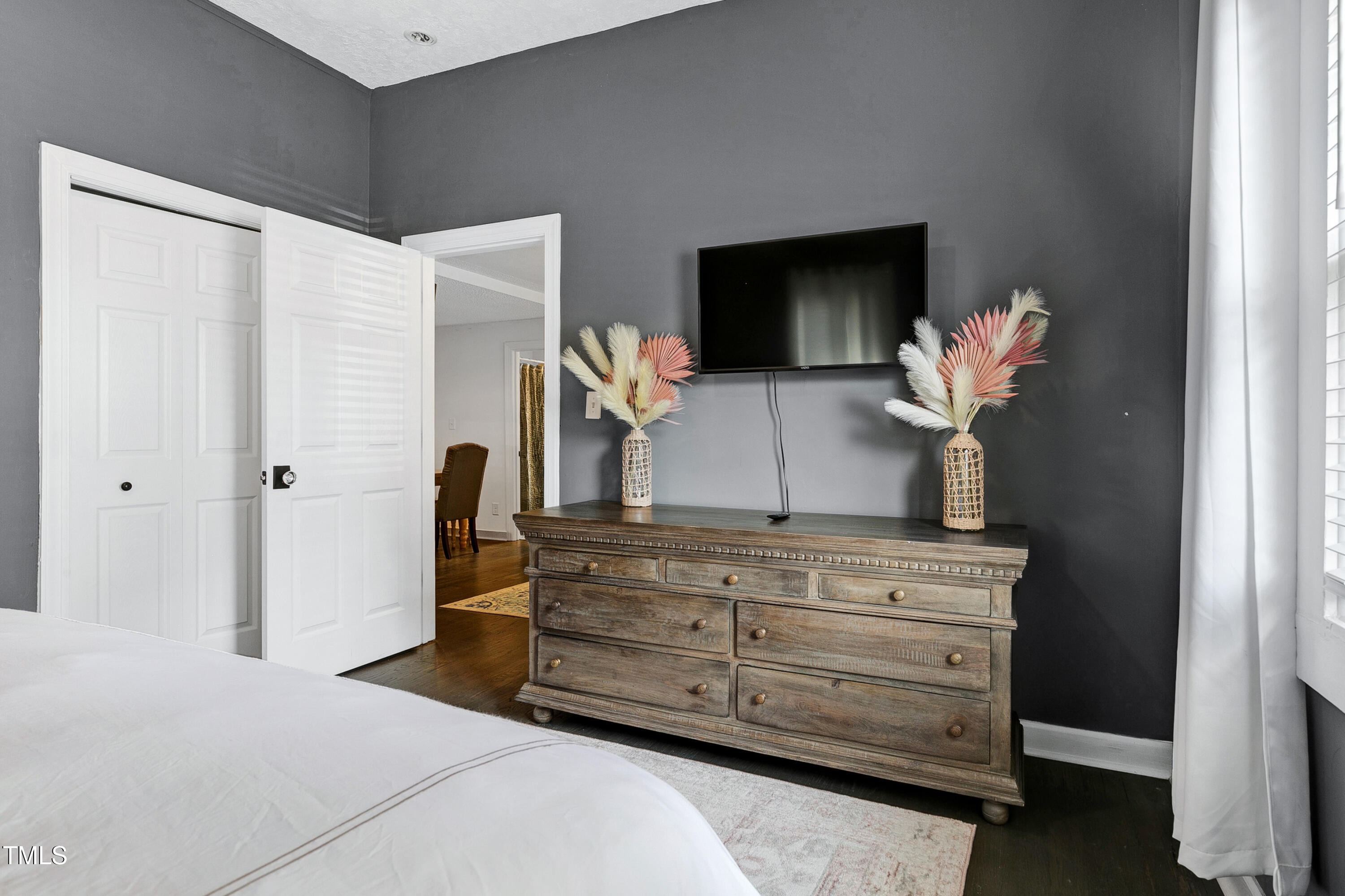 320 East Cabarrus Street Raleigh, NC 27601 - Photo 16 of 30 a bedroom with a bed and a television