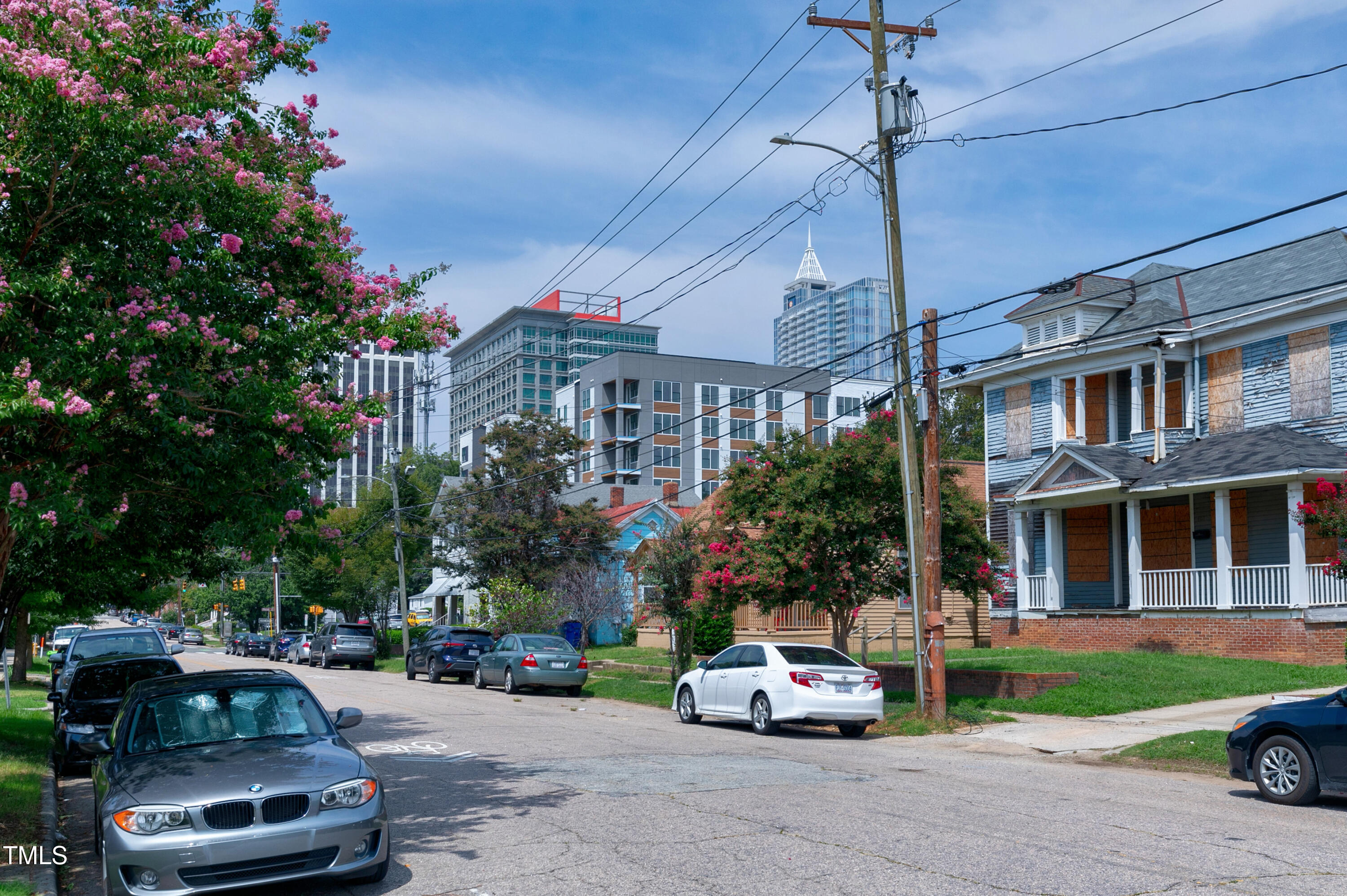 320 East Cabarrus Street Raleigh, NC 27601 - Photo 2 of 30 a car parked in front of a brick house