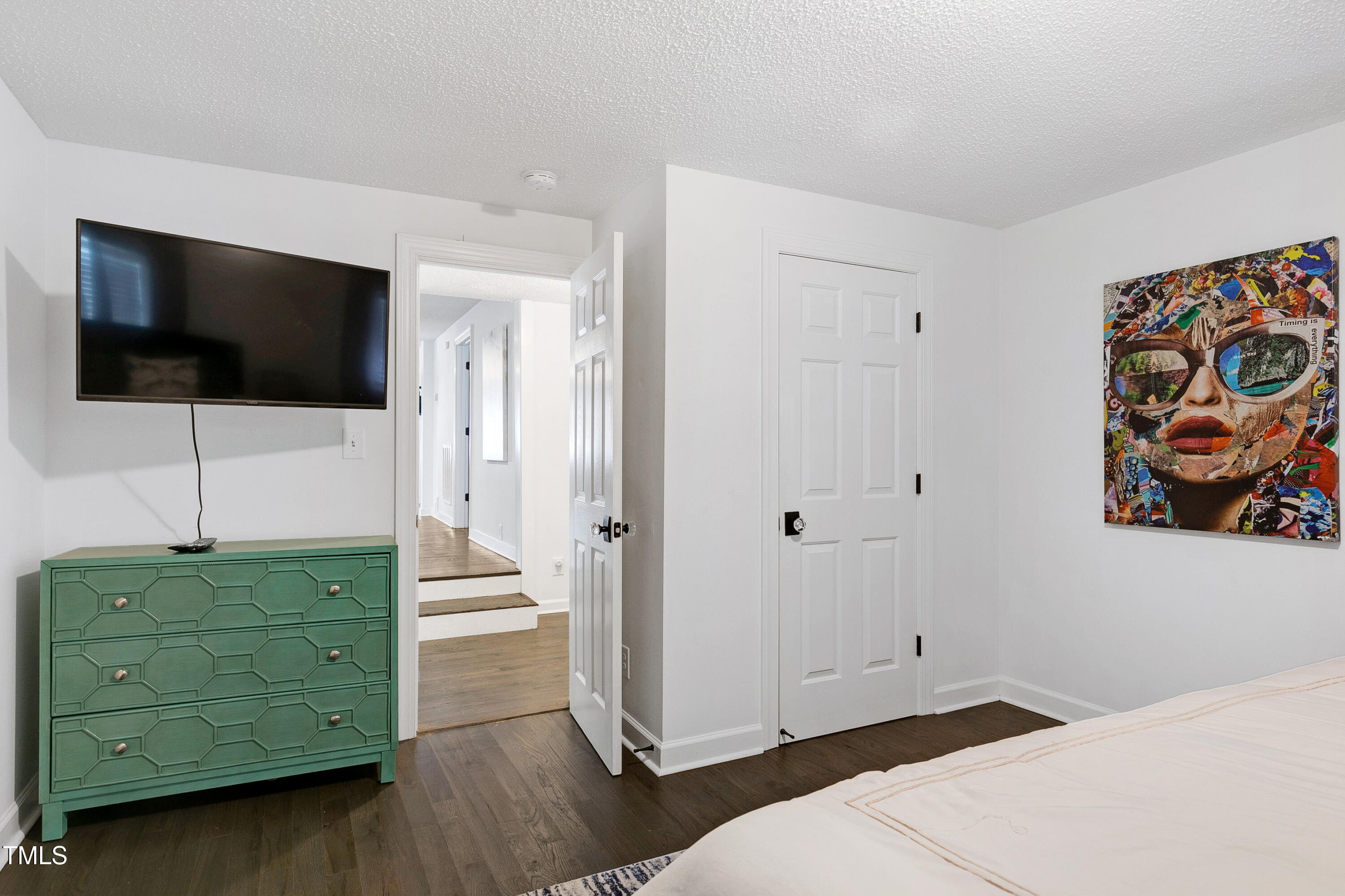 320 East Cabarrus Street Raleigh, NC 27601 - Photo 27 of 30 a bedroom with a bed and a television