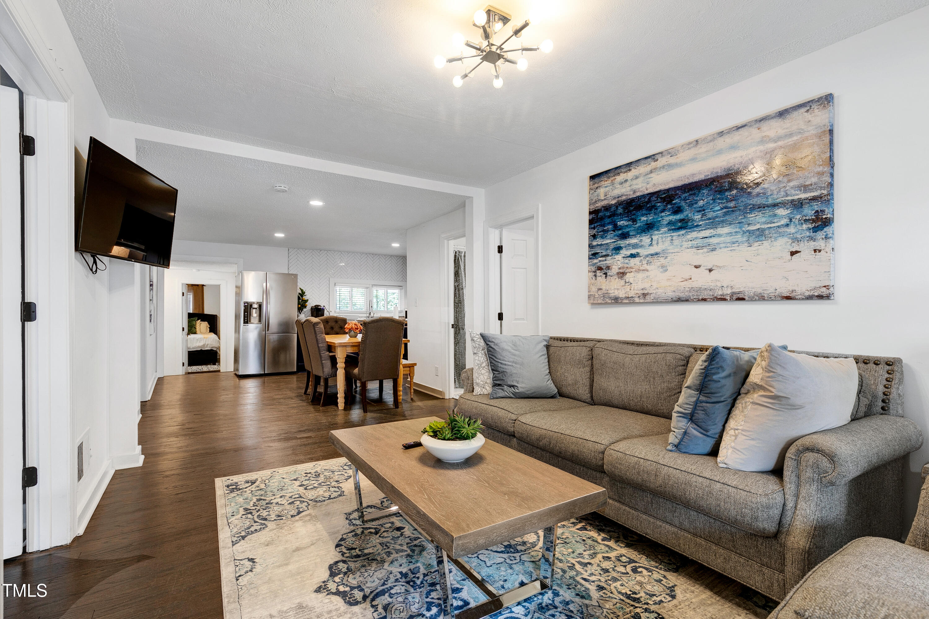 320 East Cabarrus Street Raleigh, NC 27601 - Photo 3 of 30 a living room with furniture and a flat screen tv